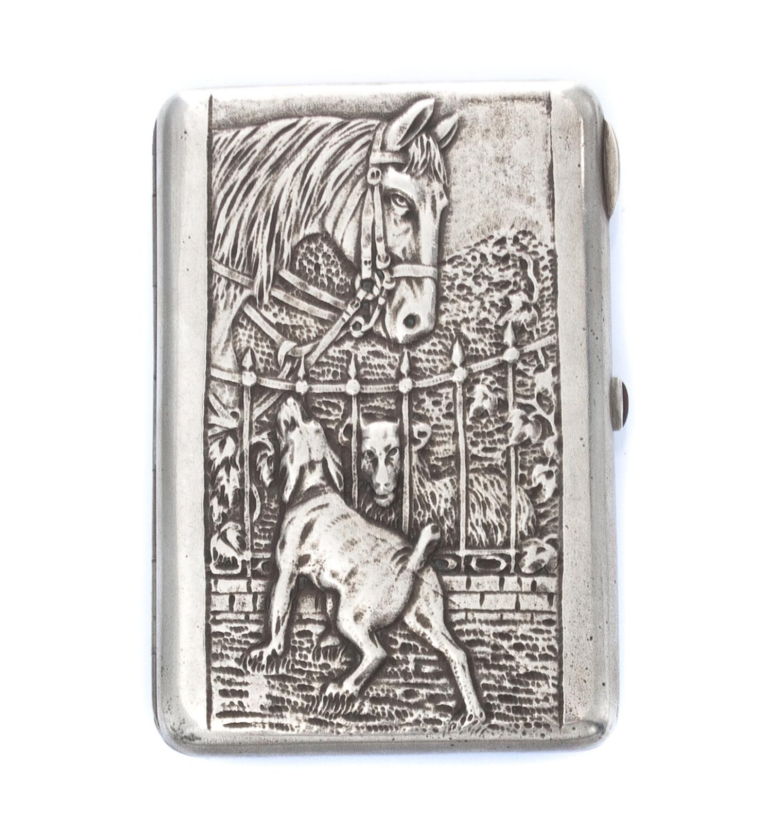 A Russian Silver Cigarette Case, Maker's Mark Cyrillic CF, obscured Artel mark, Moscow, the lid worked to show a dog, horse and sheep a