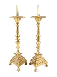 A Pair of Spanish Brass Triangular-Base Pricket Sticks