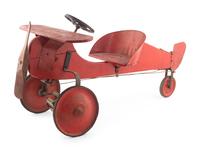 A Red-Painted Airplane Tricycle