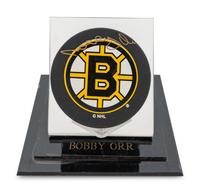 A Group of Bobby Orr and Gordie Howe Signed Autograph NHL Hockey Pucks,