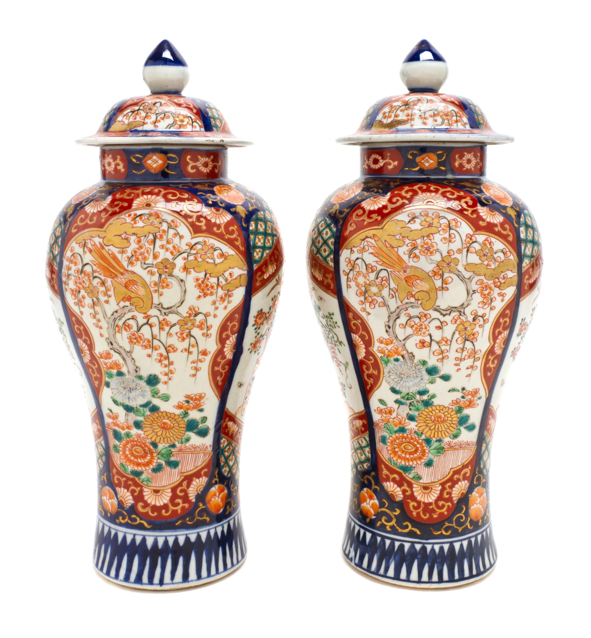 A Pair of Imari Porcelain Urns and Covers, Height 13 1/2 inches.