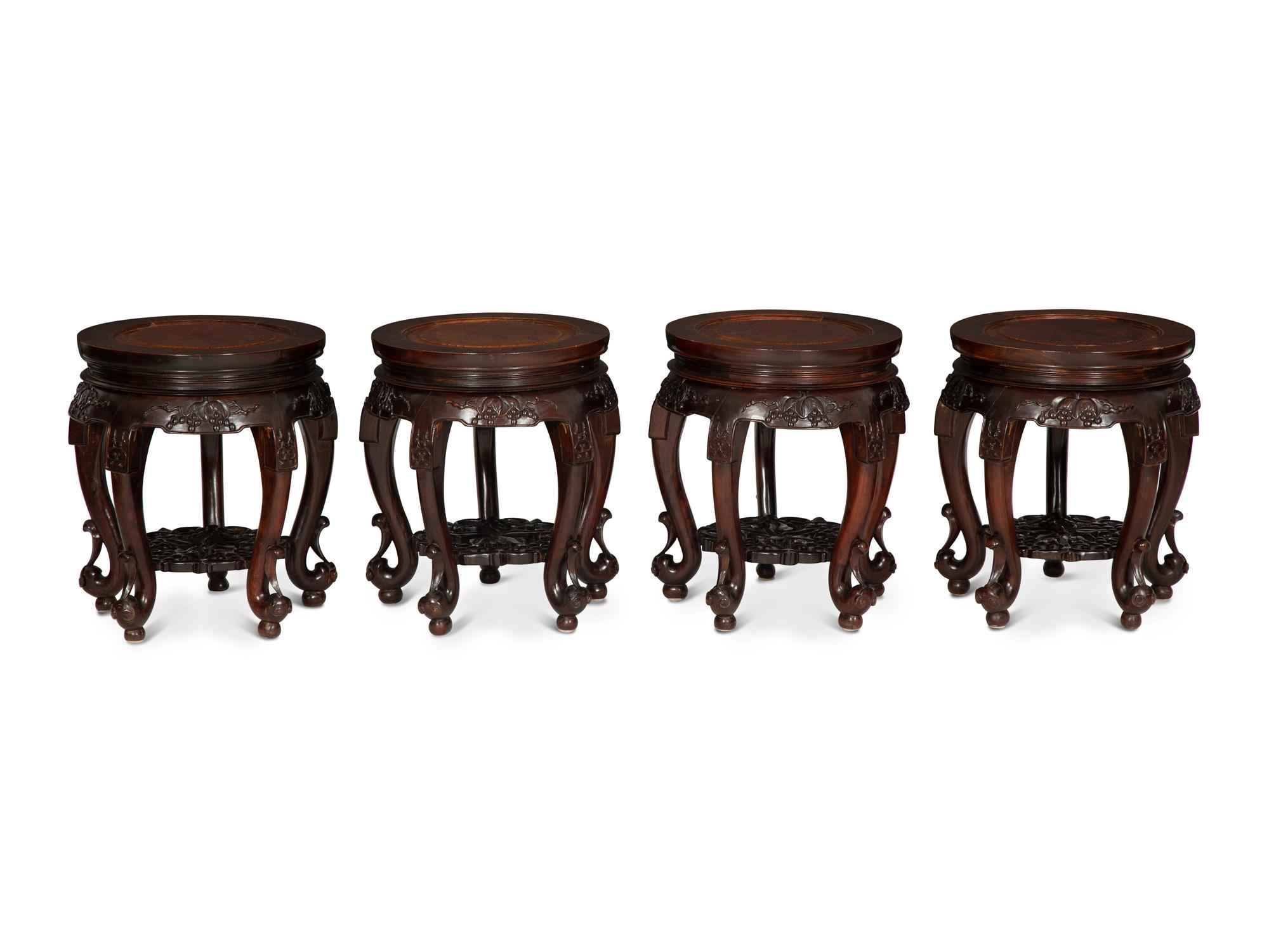 A Chinese Carved Hardwood Center Table and Four Matching Low Stools/Pedestals