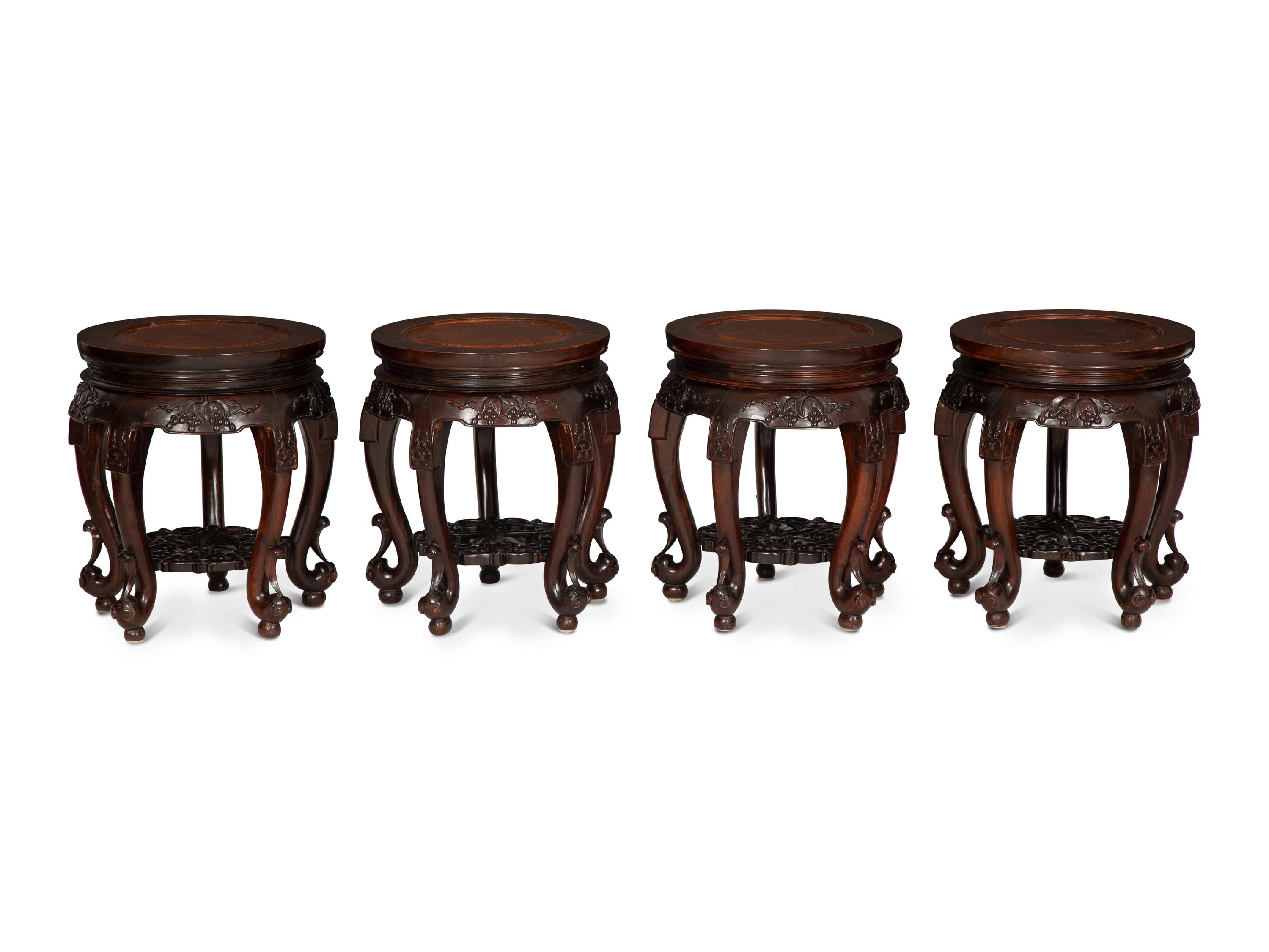 A Chinese Carved Hardwood Center Table and Four Matching Low Stools/Pedestals