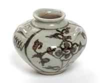 A Small Brown Glazed Pottery Water Dropper Height 2 1/4 inches.