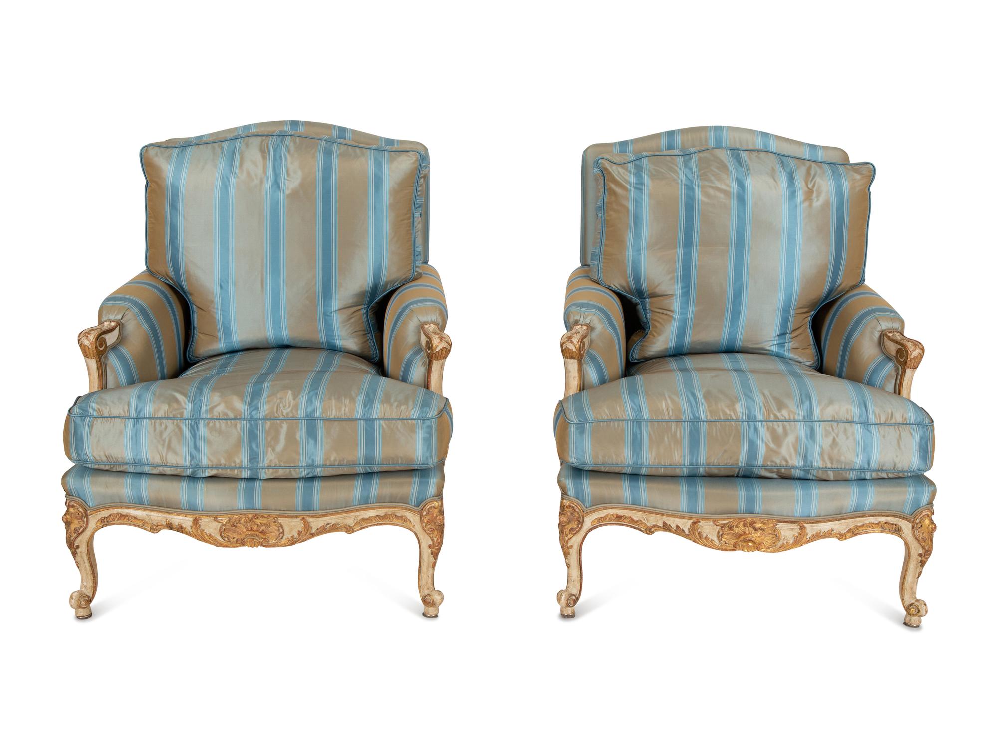 A Pair of Louis XV Style Painted and Parcel Gilt Bergeres