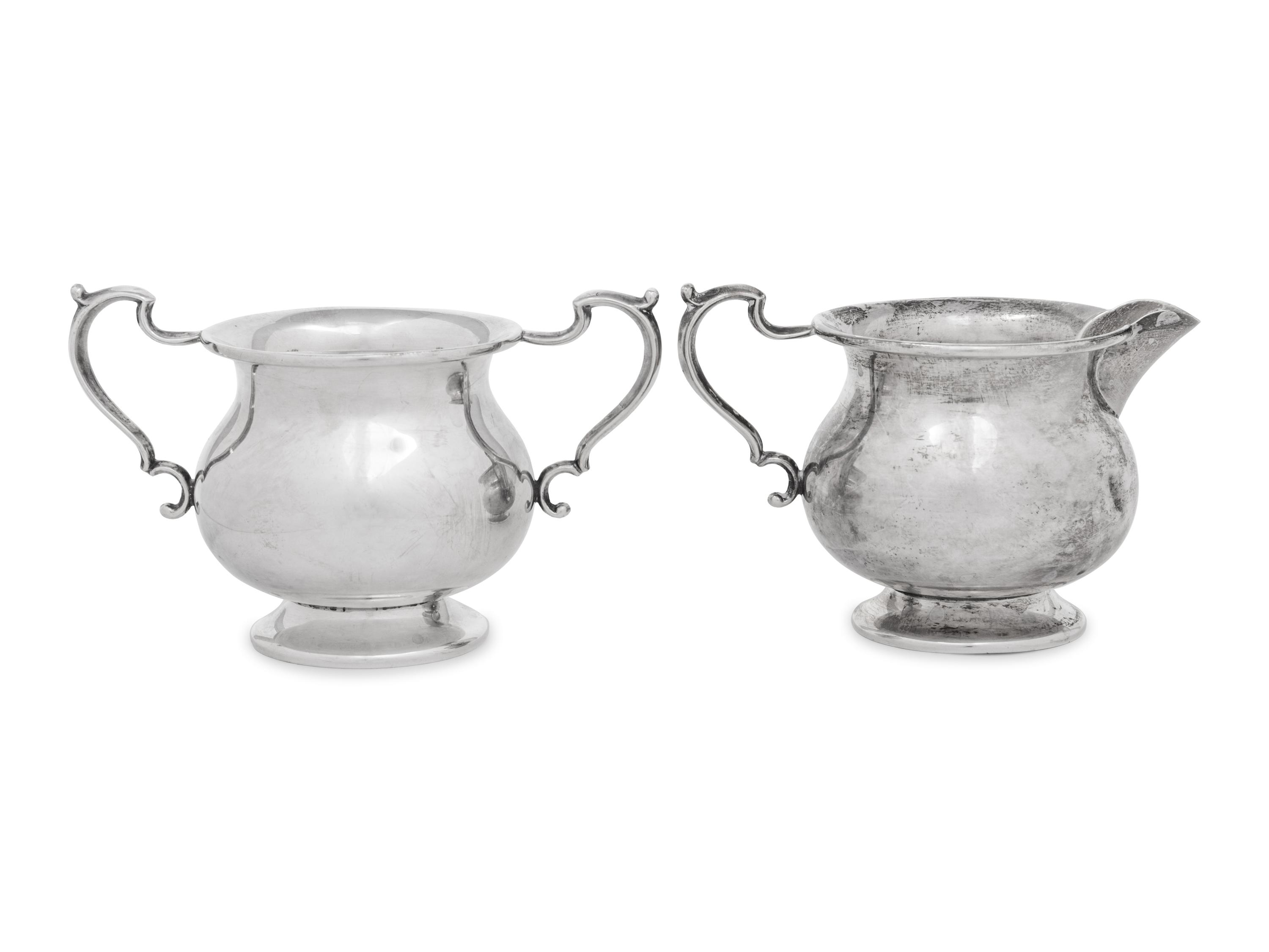 A Pair of English Silver Sauce Boats and an American Silver Sugar and Creamer Set