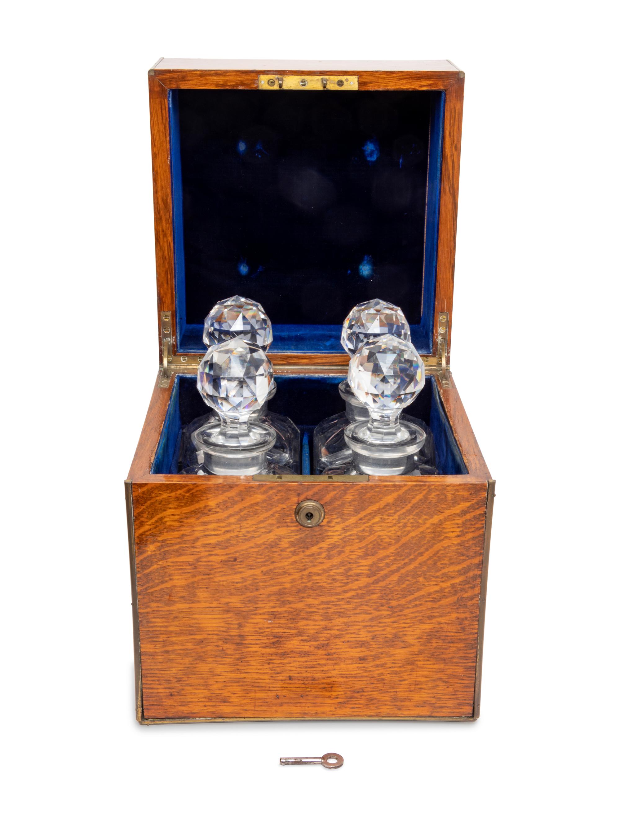 An English Oak Cased Cut Glass Decanter Set
