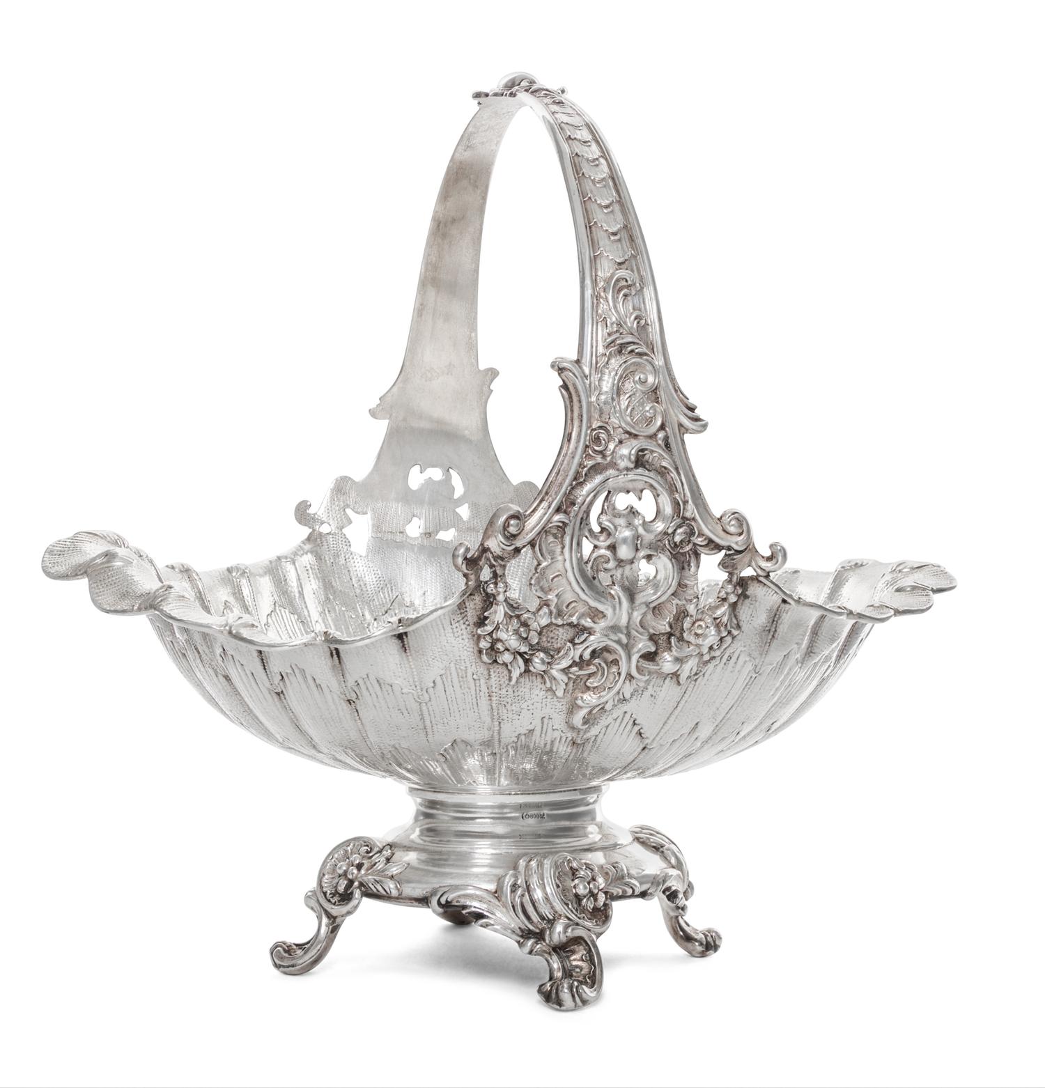 A German Silver Basket, Early 20th Cenury, of oval, handled form with scrolling foliate decoration.