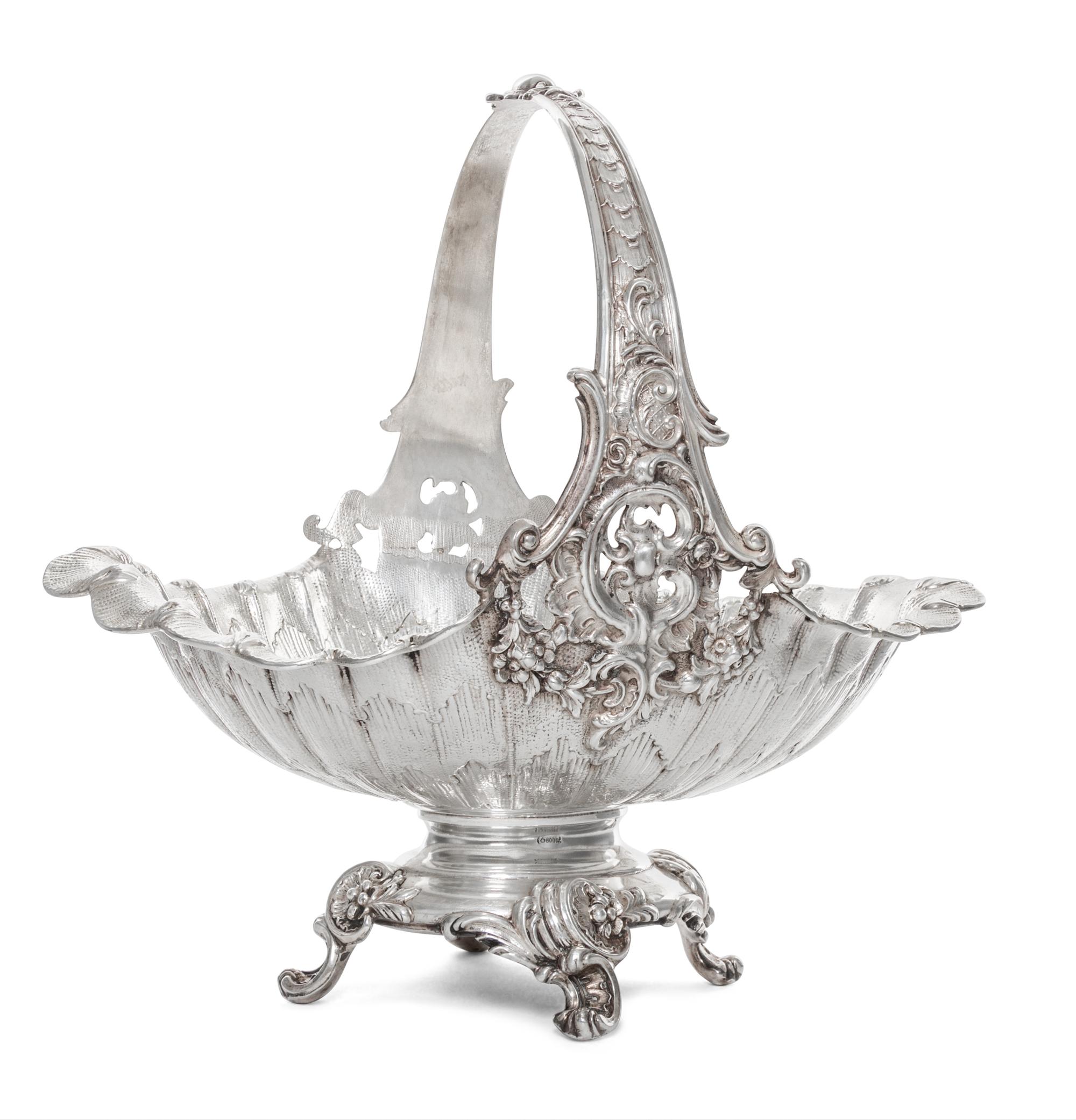 A German Silver Basket, Early 20th Cenury, of oval, handled form with scrolling foliate decoration.