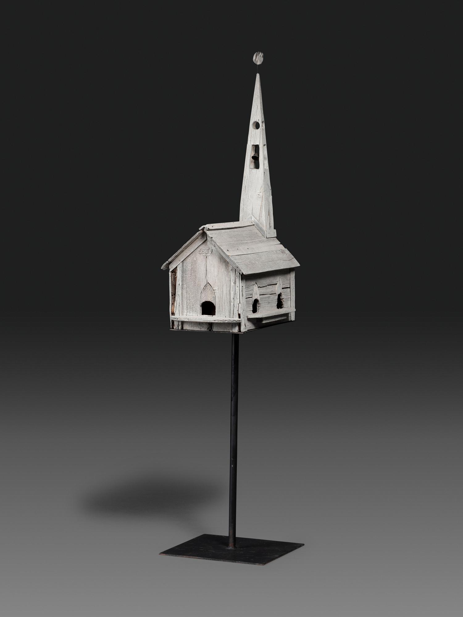 A Carved Wood Church Form Bird House on Stand