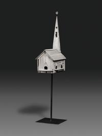 A Carved Wood Church Form Bird House on Stand