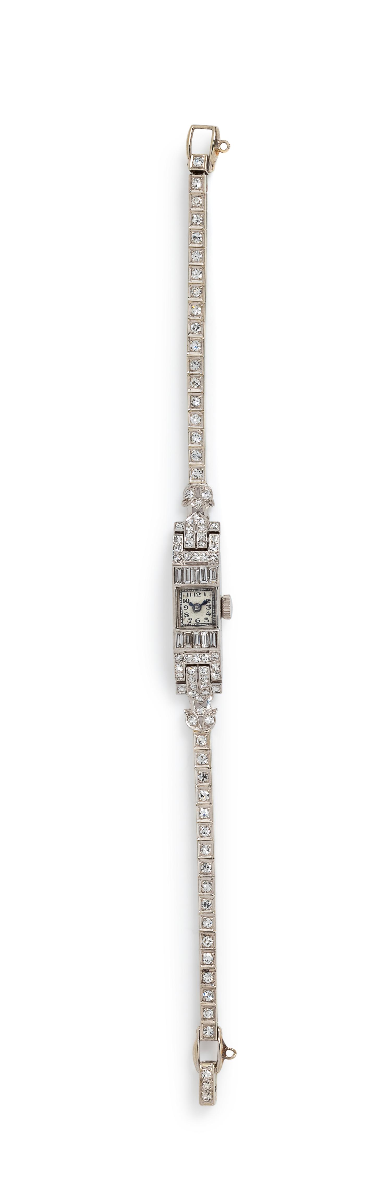 A Platinum, 14 Karat White Gold and Diamond Bracelet,