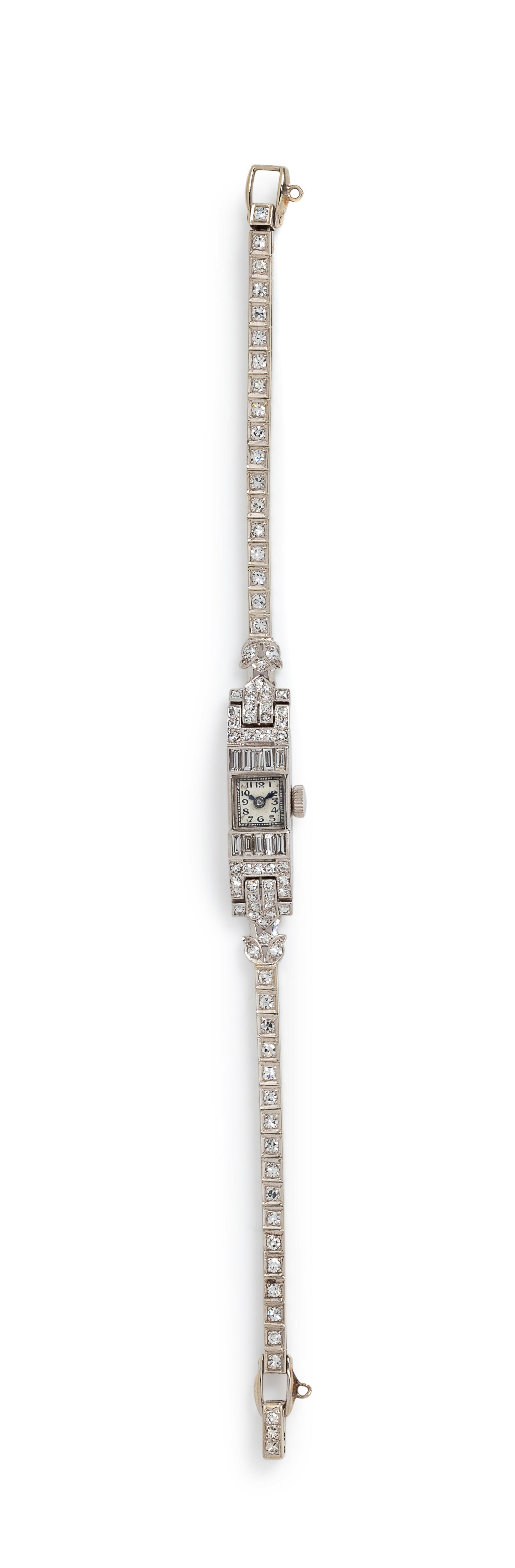 A Platinum, 14 Karat White Gold and Diamond Bracelet,