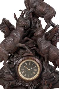 A Black Forest Carved Mantel Clock