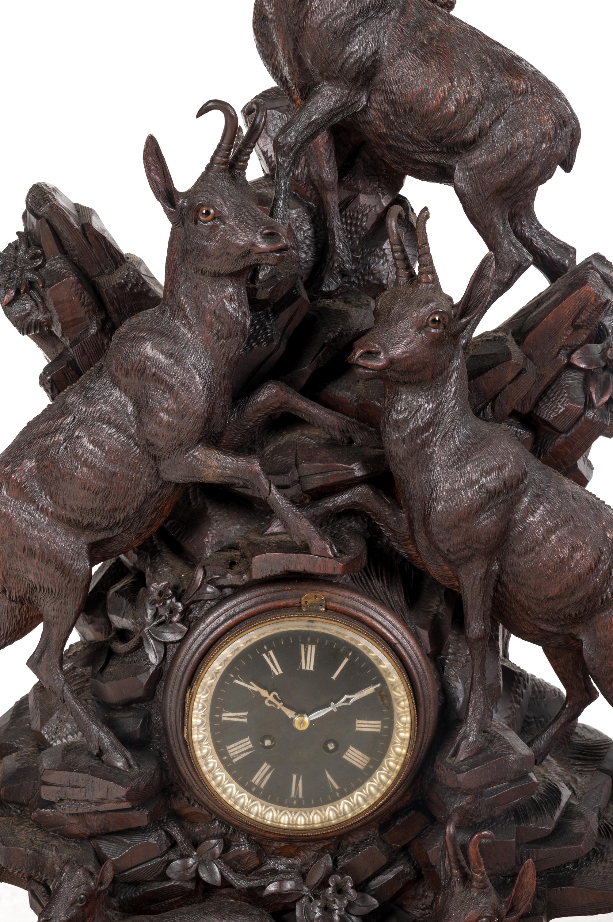 A Black Forest Carved Mantel Clock