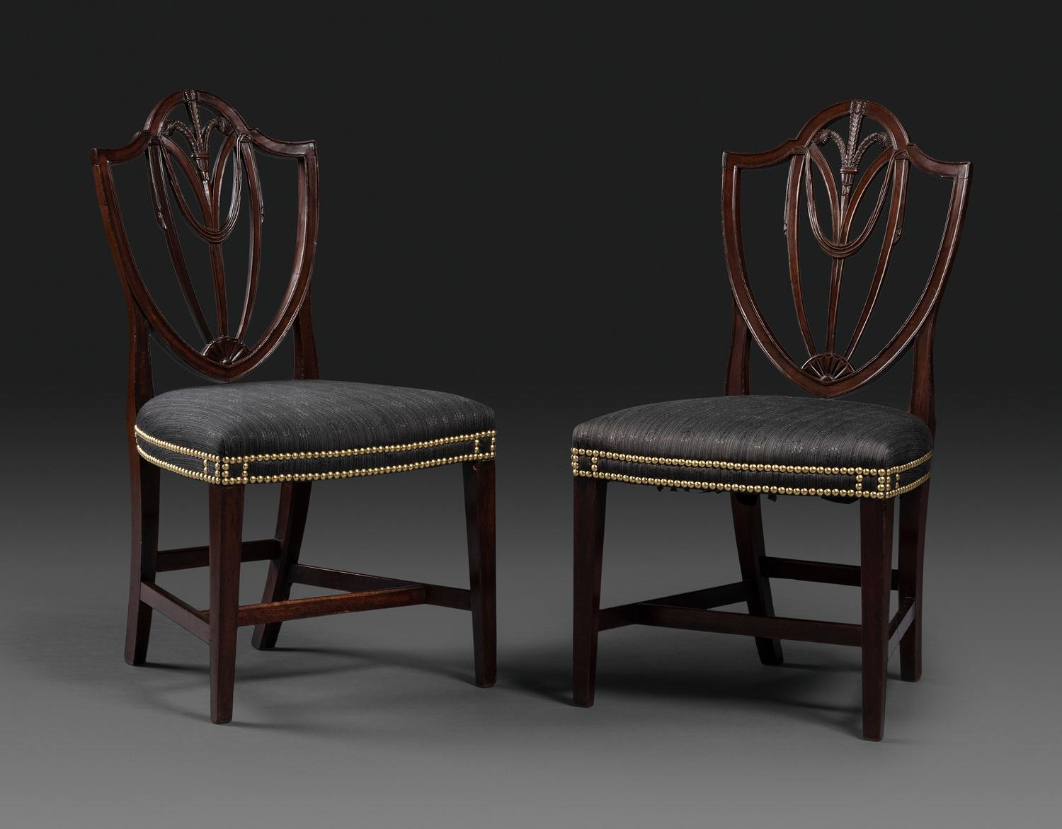 A Pair of Federal Carved Mahogany Shield-Back Dining Chairs