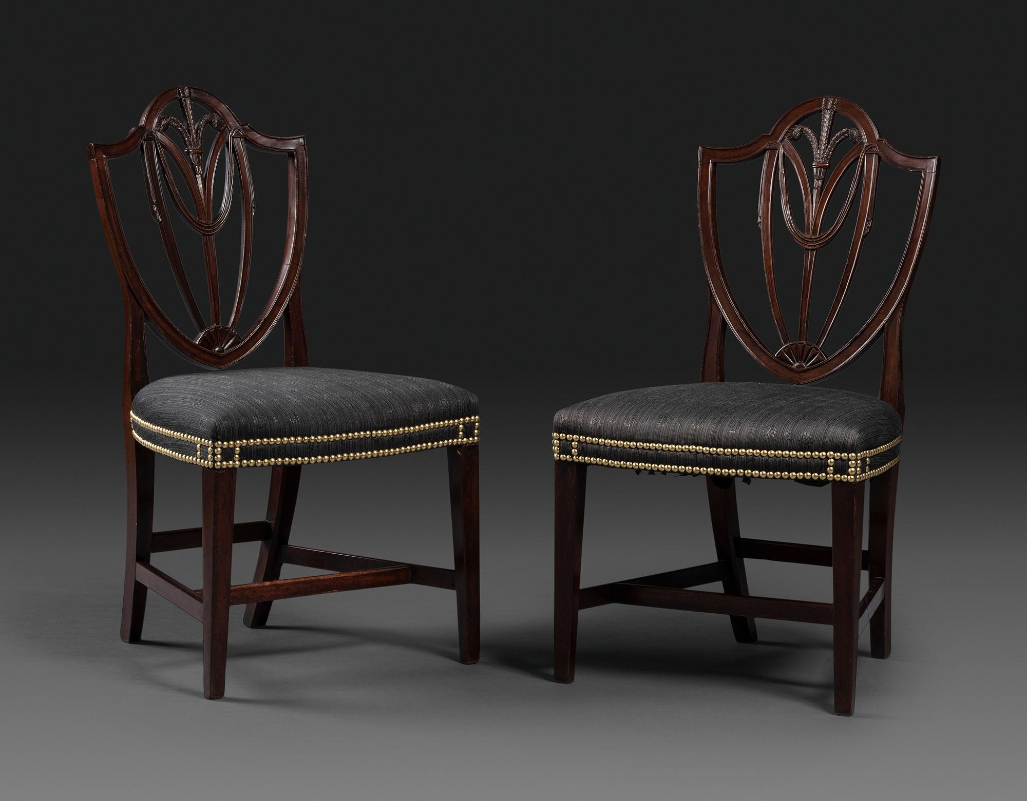 A Pair of Federal Carved Mahogany Shield-Back Dining Chairs