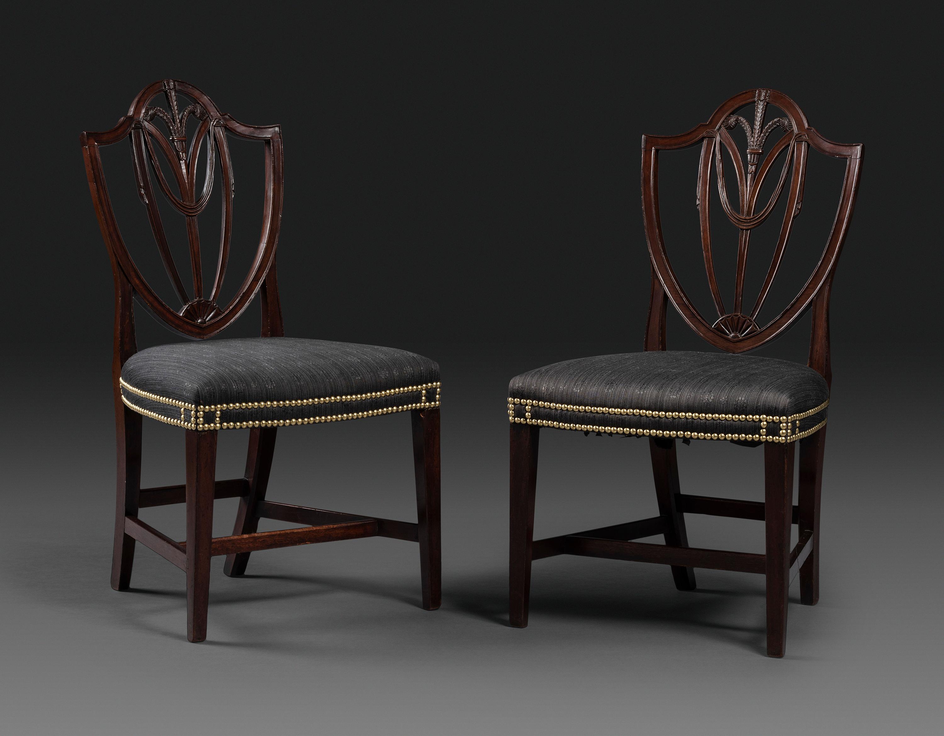 A Pair of Federal Carved Mahogany Shield-Back Dining Chairs