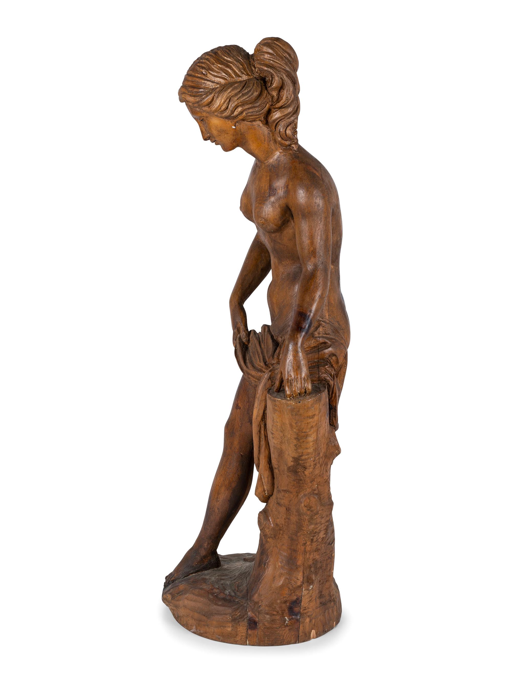 A Classically Inspired Carved Wooden Sculpture of a Standing Nude Female