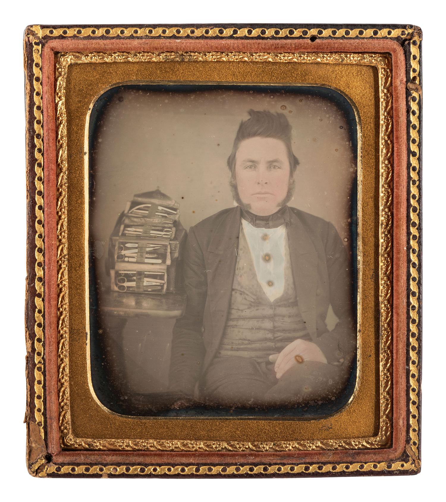 [EARLY PHOTOGRAPHY]. Sixth plate daguerreotype featuring a doctor/dentist posed with his bag of instruments.