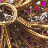 An 18K Yellow Gold, Diamond, and Ruby Brooch