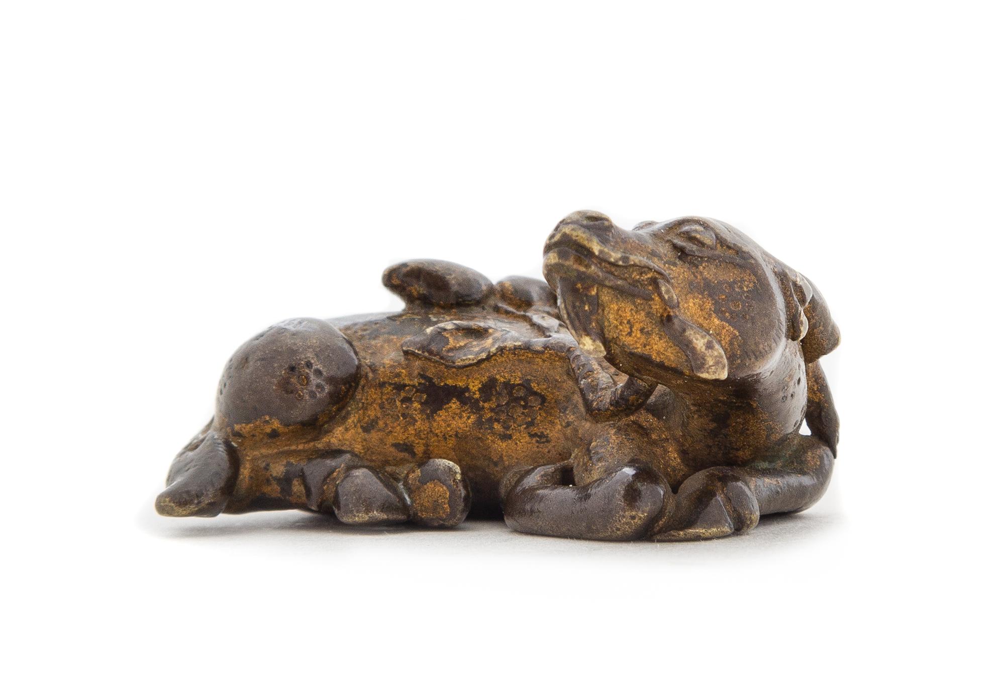 A Gilt Bronze Deer-Form Weight Length 1 3/4 inches. — MING DYNASTY, 16TH/17TH CENTURY
