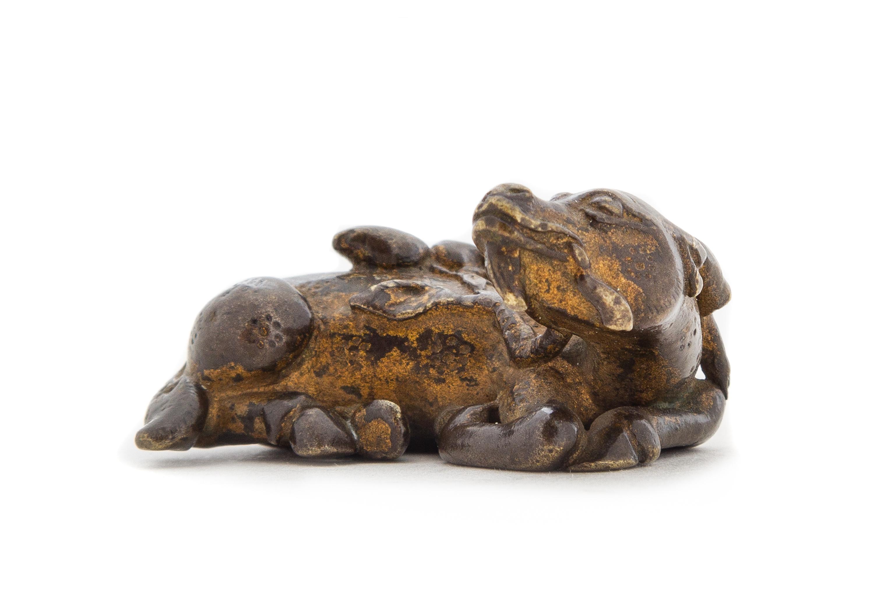 A Gilt Bronze Deer-Form Weight Length 1 3/4 inches. — MING DYNASTY, 16TH/17TH CENTURY