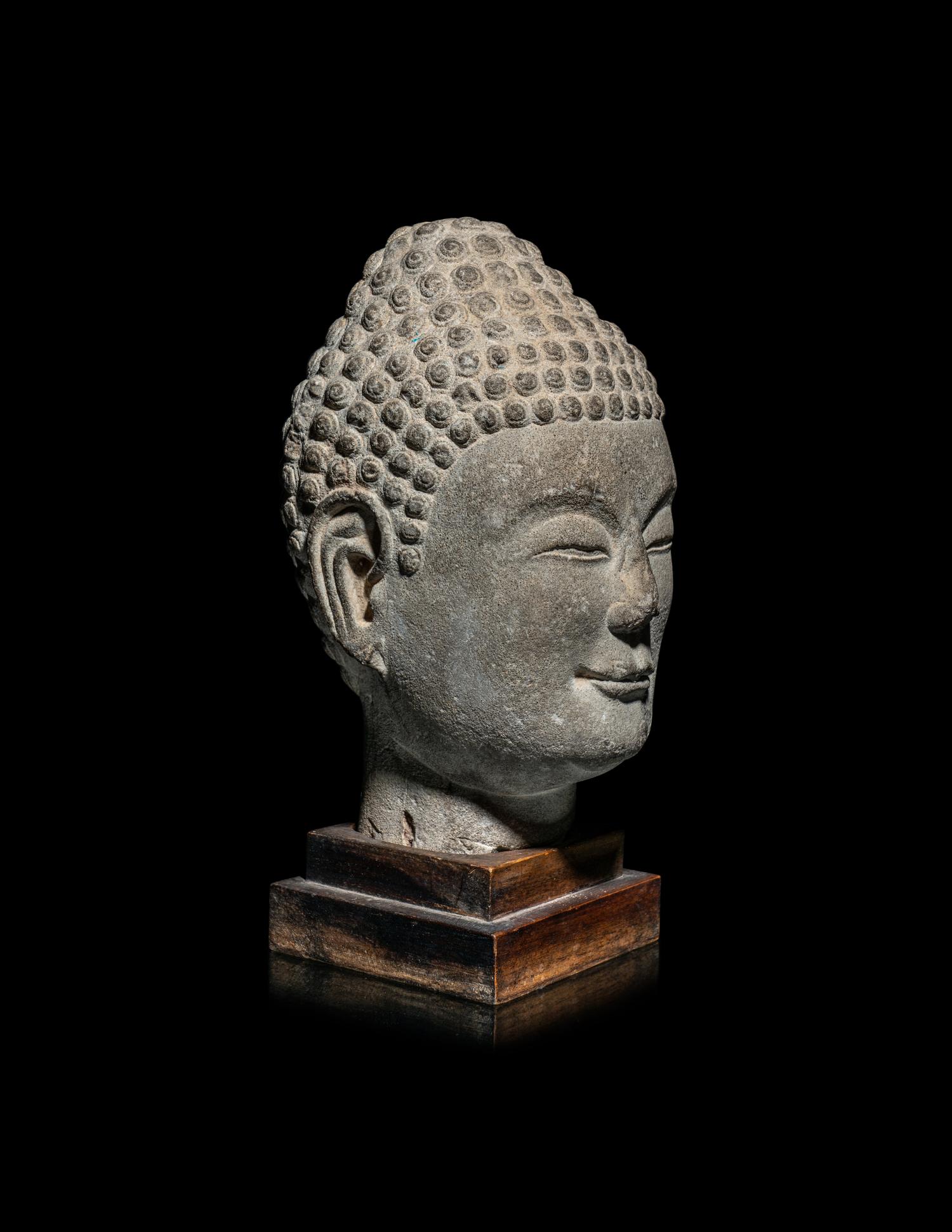 A Chinese Carved Stone Head of Buddha