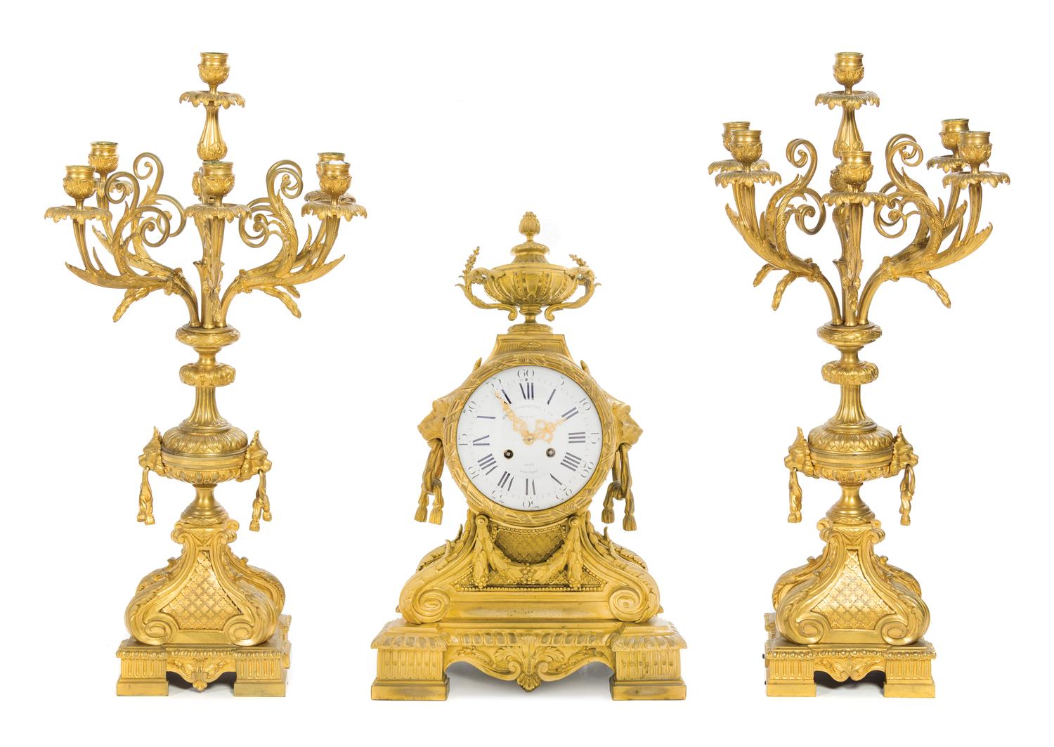 A Napoleon III Gilt Bronze Clock Garniture Height of clock 25 1/2 inches. — LEMERLE-CHARPENTIER & CIE, PARIS, 19TH CENTURY