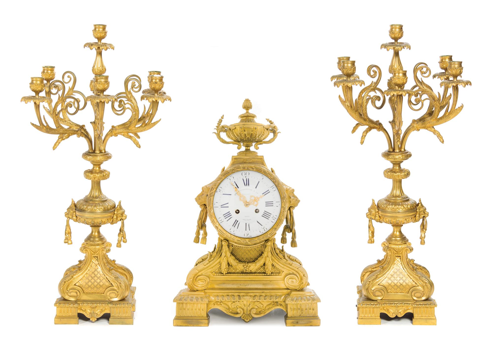 A Napoleon III Gilt Bronze Clock Garniture Height of clock 25 1/2 inches. — LEMERLE-CHARPENTIER & CIE, PARIS, 19TH CENTURY
