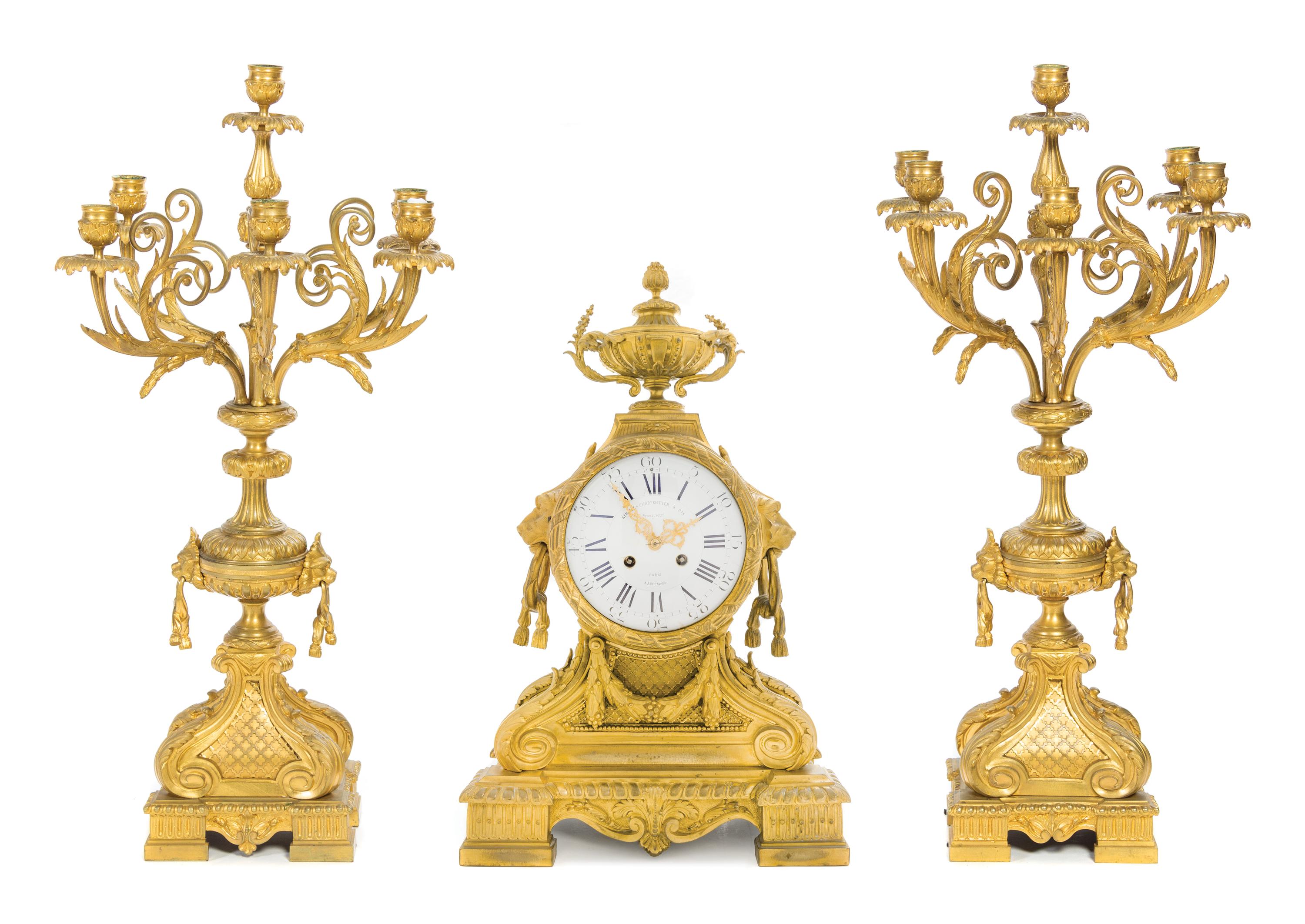 A Napoleon III Gilt Bronze Clock Garniture Height of clock 25 1/2 inches. — LEMERLE-CHARPENTIER & CIE, PARIS, 19TH CENTURY
