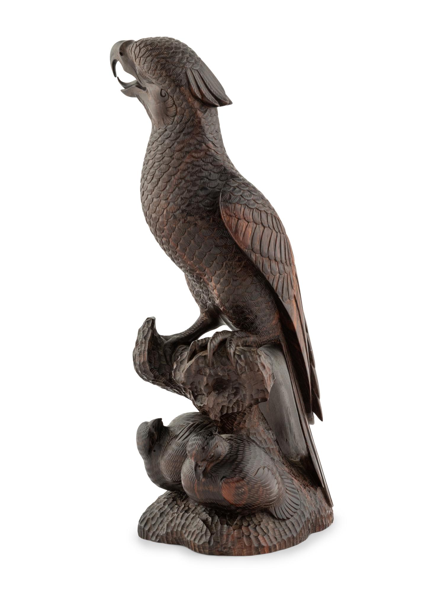 A Japanese Style Carved Rosewood Hawk with Chicks