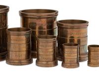 A Set of Eight English Brass Graduated Imperial Bushel Measures