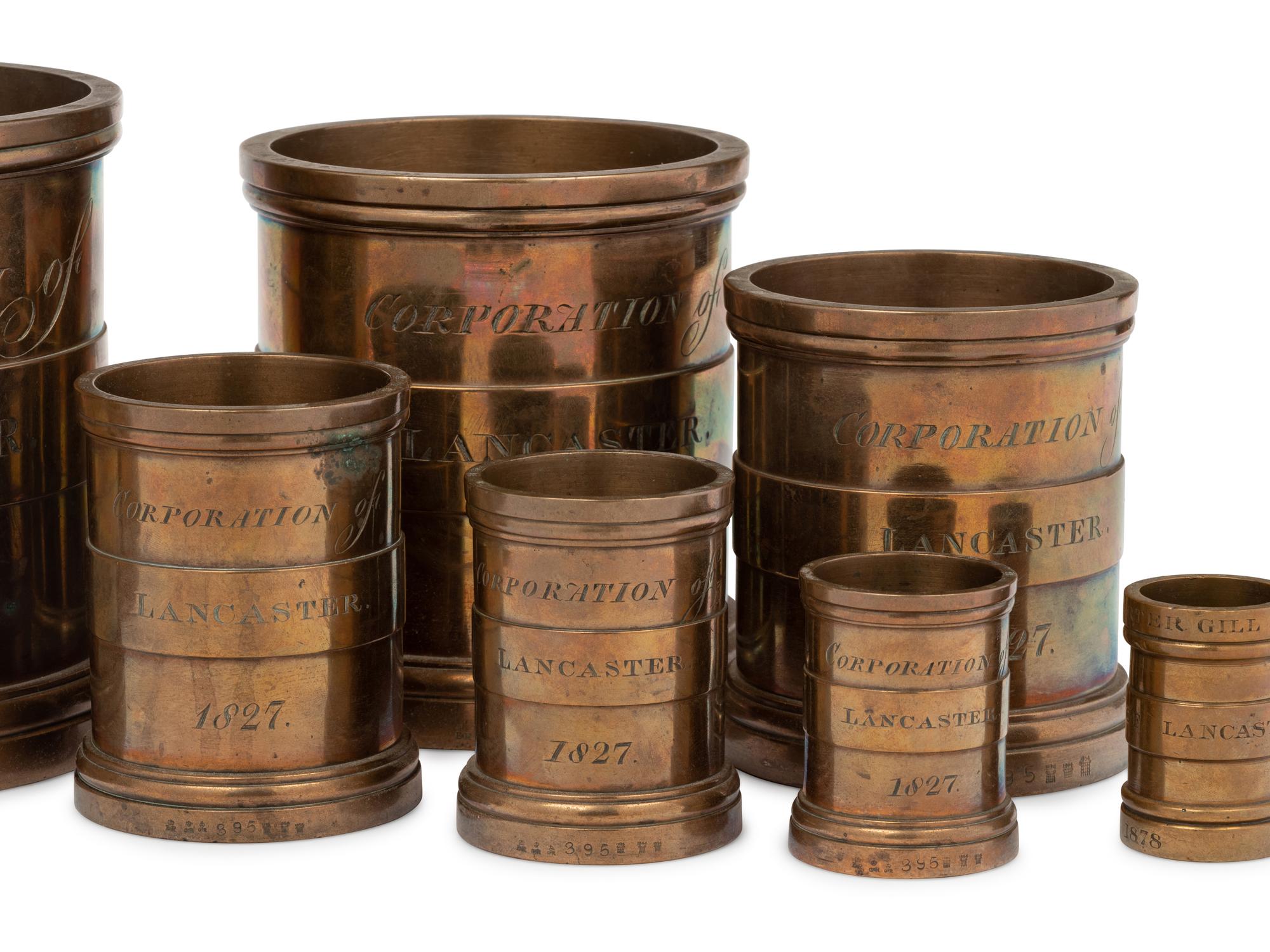 A Set of Eight English Brass Graduated Imperial Bushel Measures