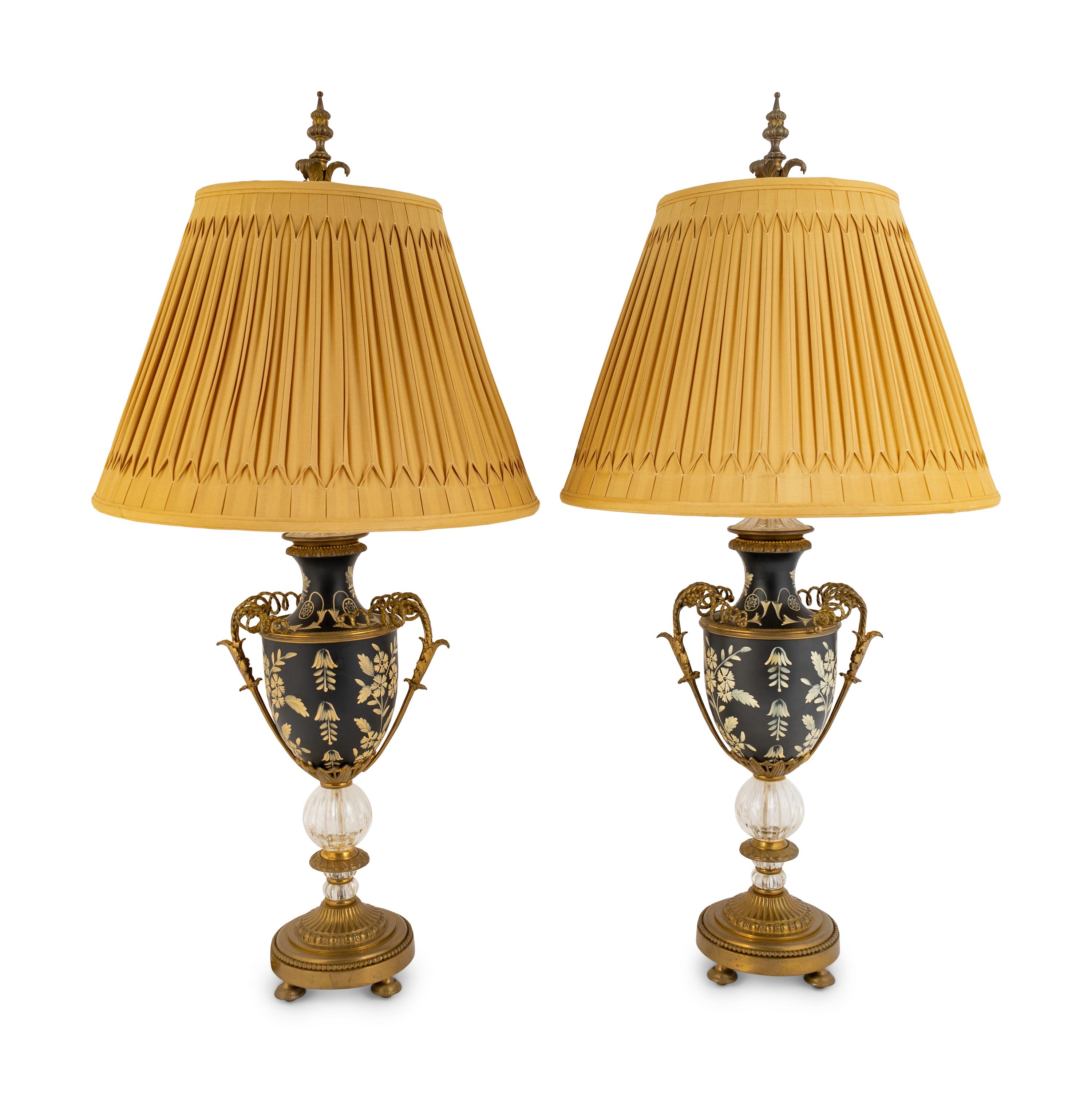 A Pair of Tole and Glass Lamps