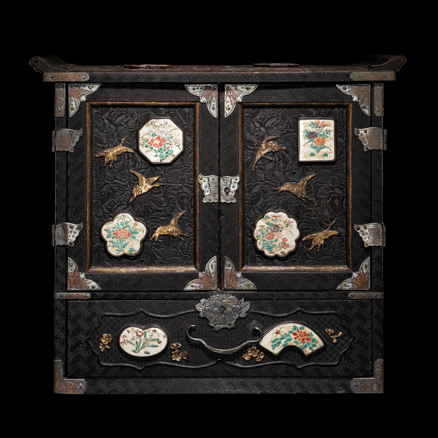 A Japanese Porcelain and Metal Inset Wood Chest
