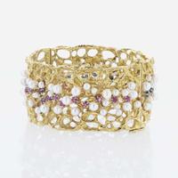 An 18K Yellow Gold and Gemstone Bangle by Karl Stittgen