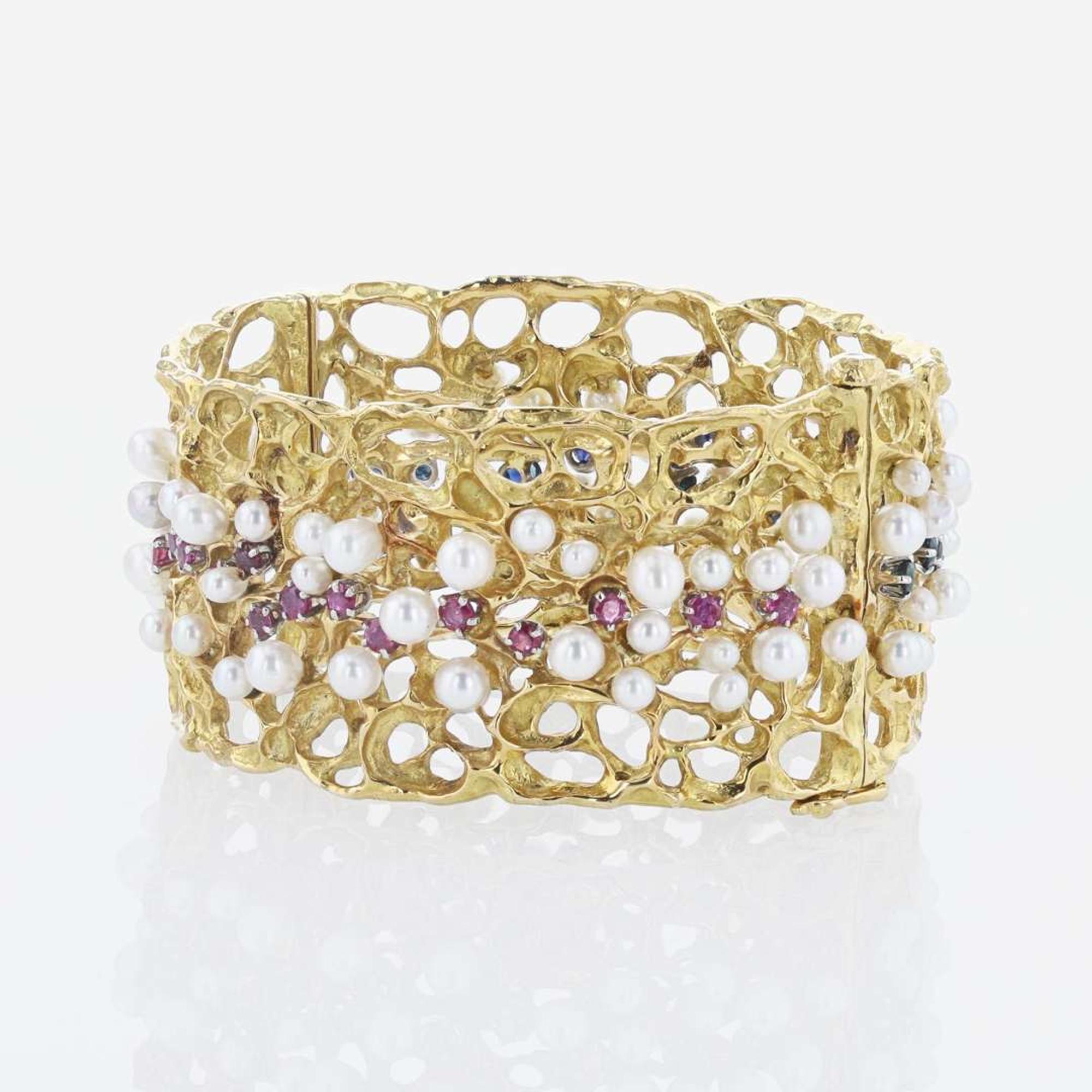 An 18K Yellow Gold and Gemstone Bangle by Karl Stittgen