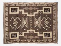 A large Navajo woven rug with whirling logs, early 20th century