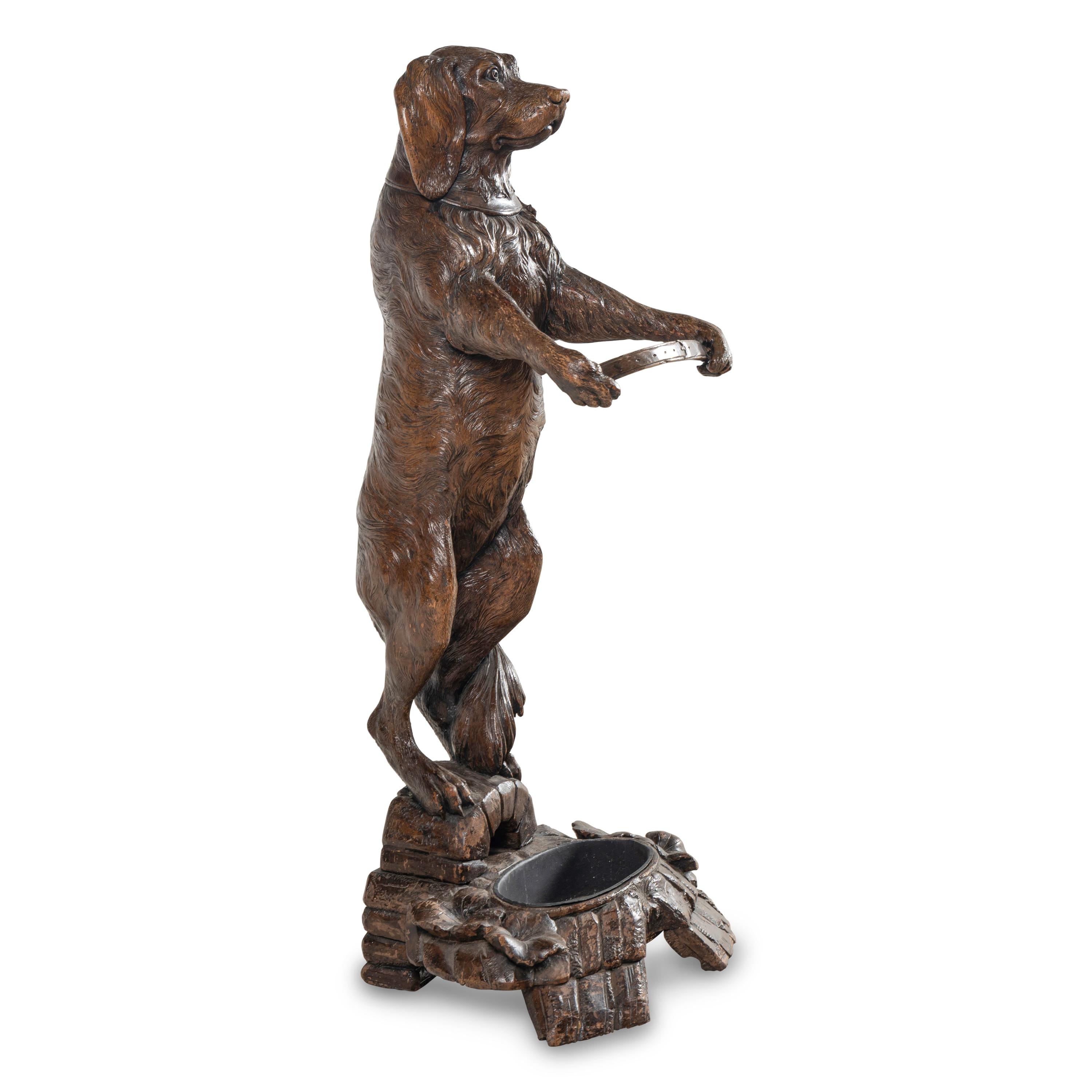 A Swiss "Black Forest" Carved Figural Umbrella Stand