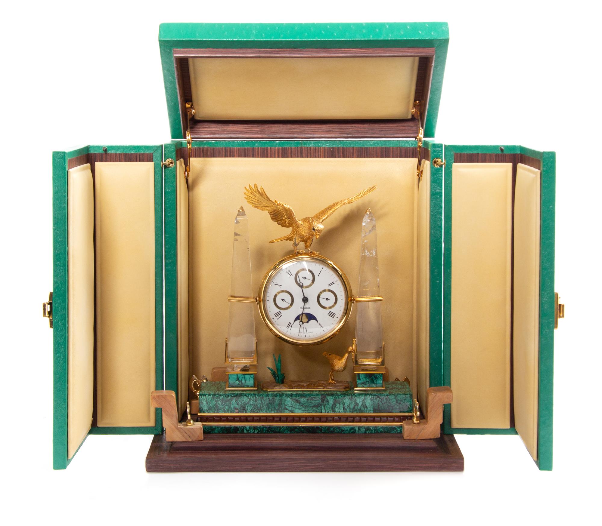 A Swiss Gilt Metal, Rock Crystal and Malachite Veneered Desk Clock, Mouawad Height 13 inches. — MODERN