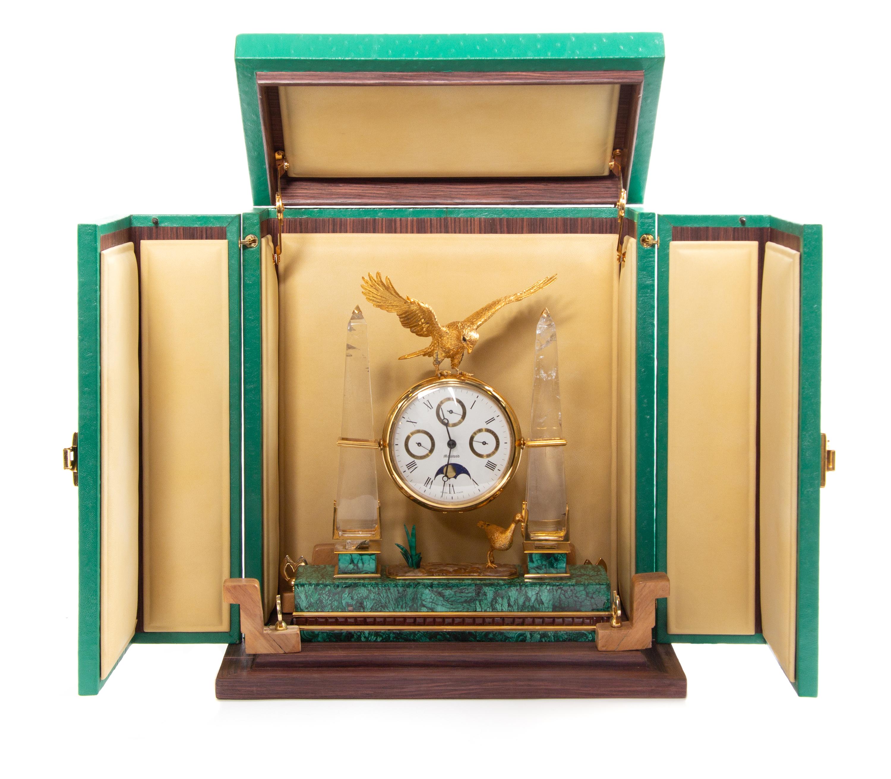 A Swiss Gilt Metal, Rock Crystal and Malachite Veneered Desk Clock, Mouawad Height 13 inches. — MODERN