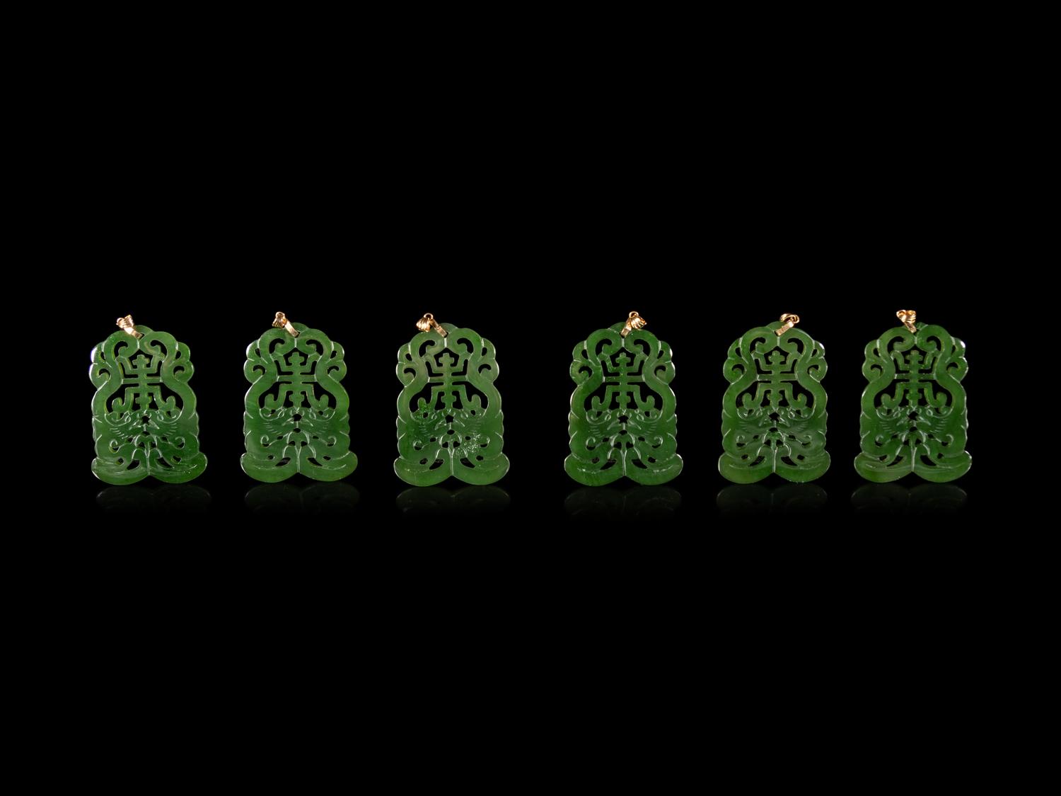Twenty-One Chinese Spinach Jade Pendants