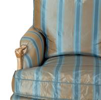 A Pair of Louis XV Style Painted and Parcel Gilt Bergeres