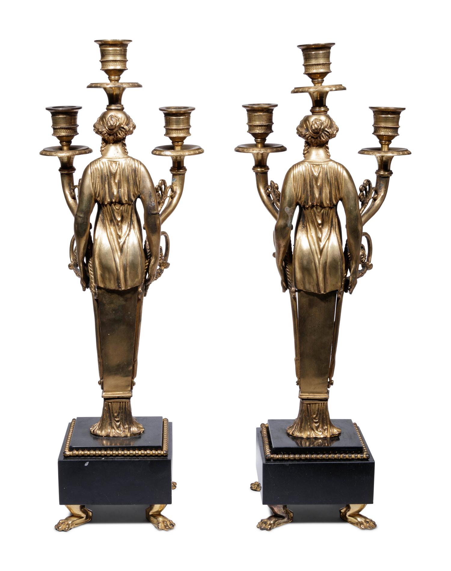 A Pair of Empire Style Gilt Bronze Figural Three-Light Candelabra