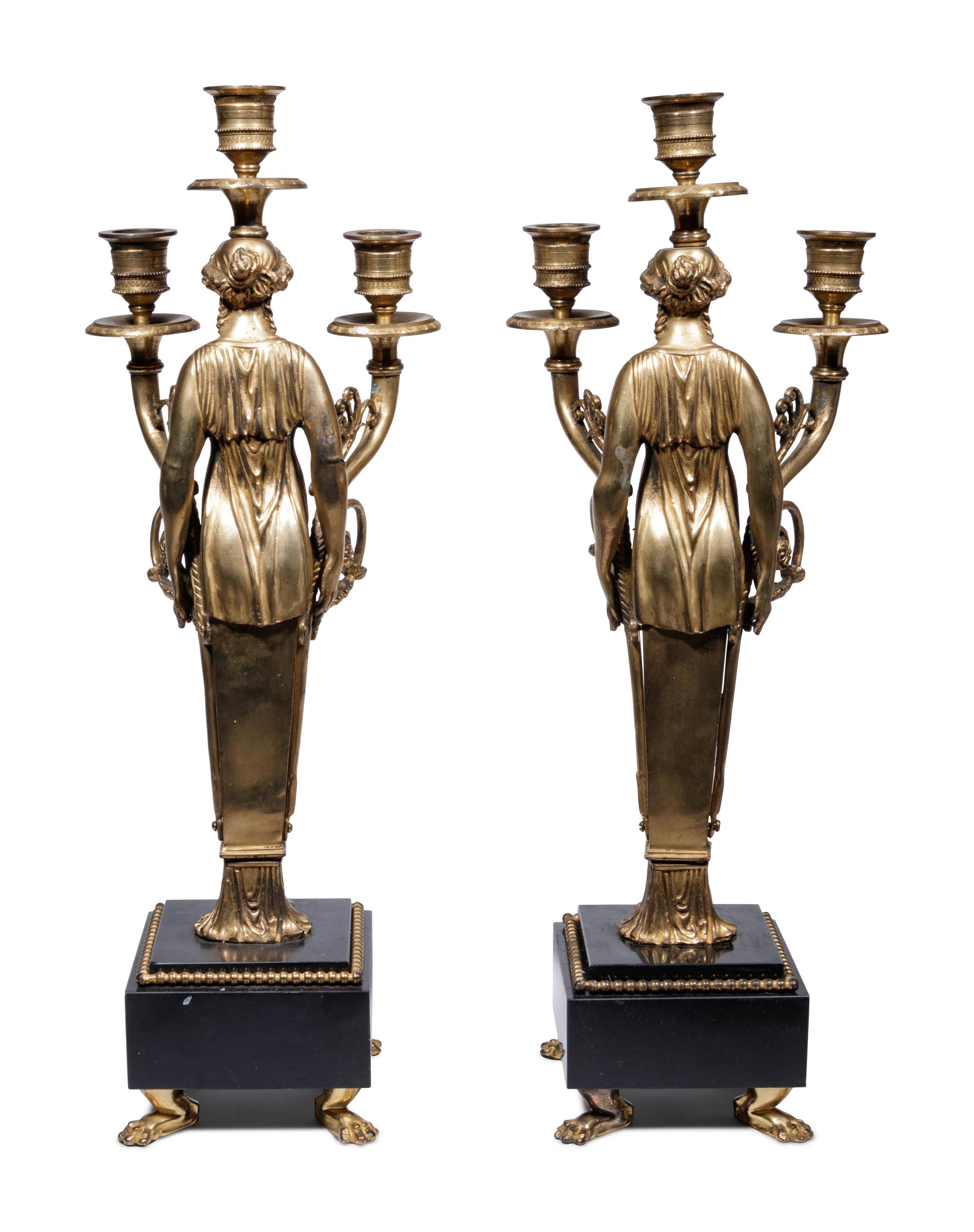 A Pair of Empire Style Gilt Bronze Figural Three-Light Candelabra