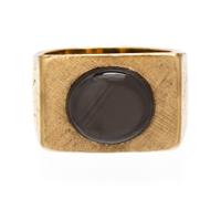A 14 Karat Yellow Gold and Black Star Sapphire Ring, 12.20 dwts.