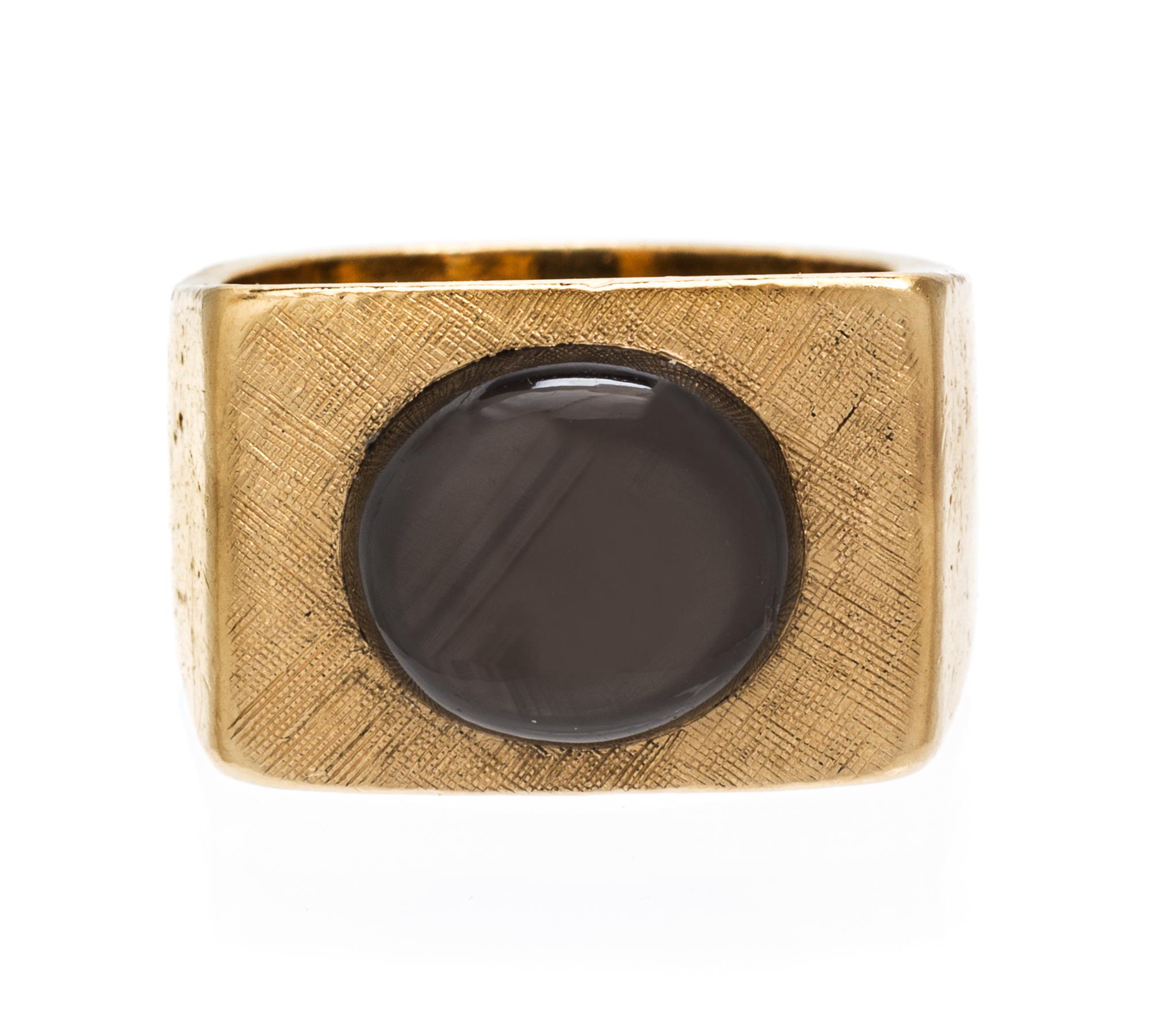 A 14 Karat Yellow Gold and Black Star Sapphire Ring, 12.20 dwts.