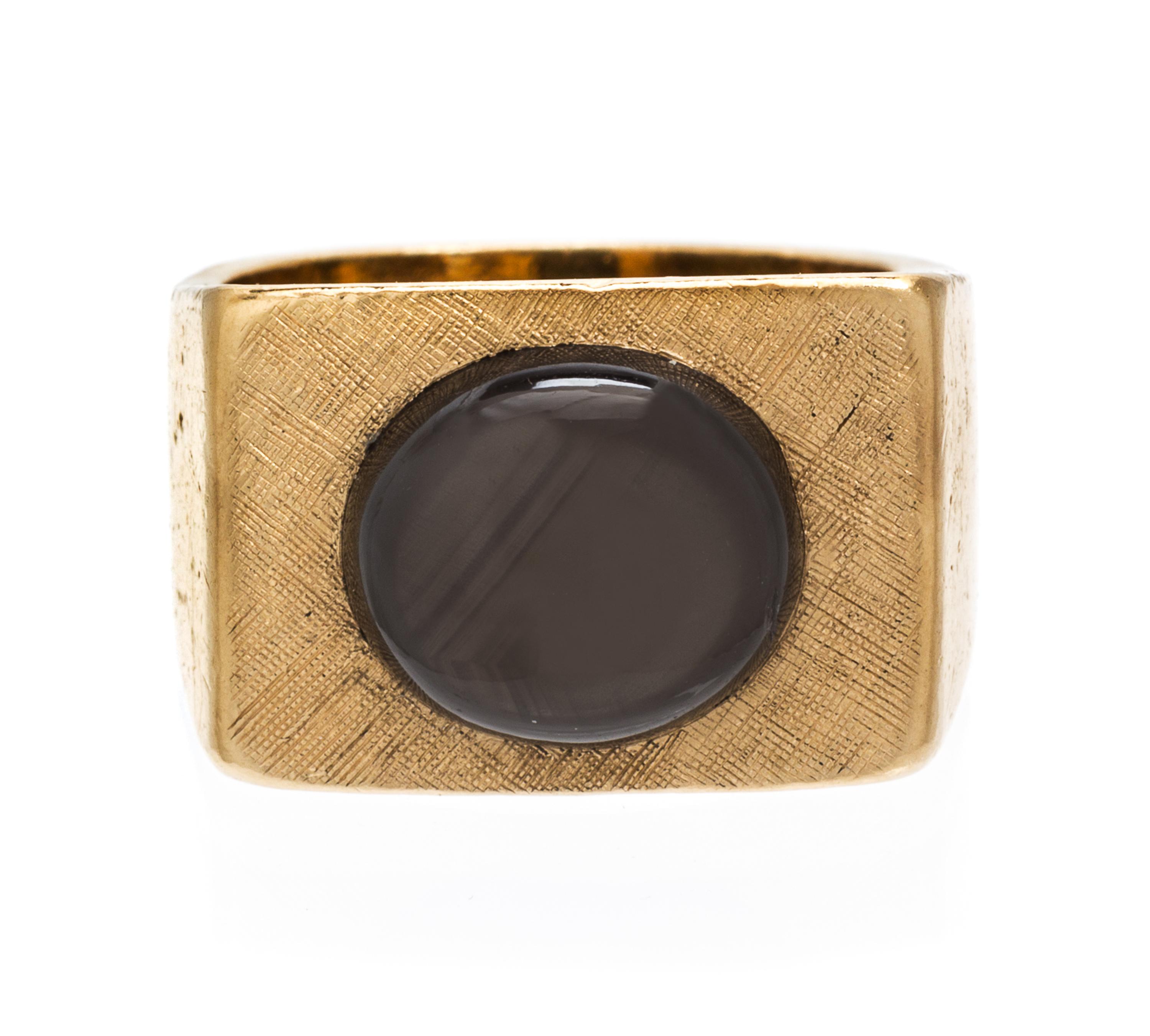 A 14 Karat Yellow Gold and Black Star Sapphire Ring, 12.20 dwts.