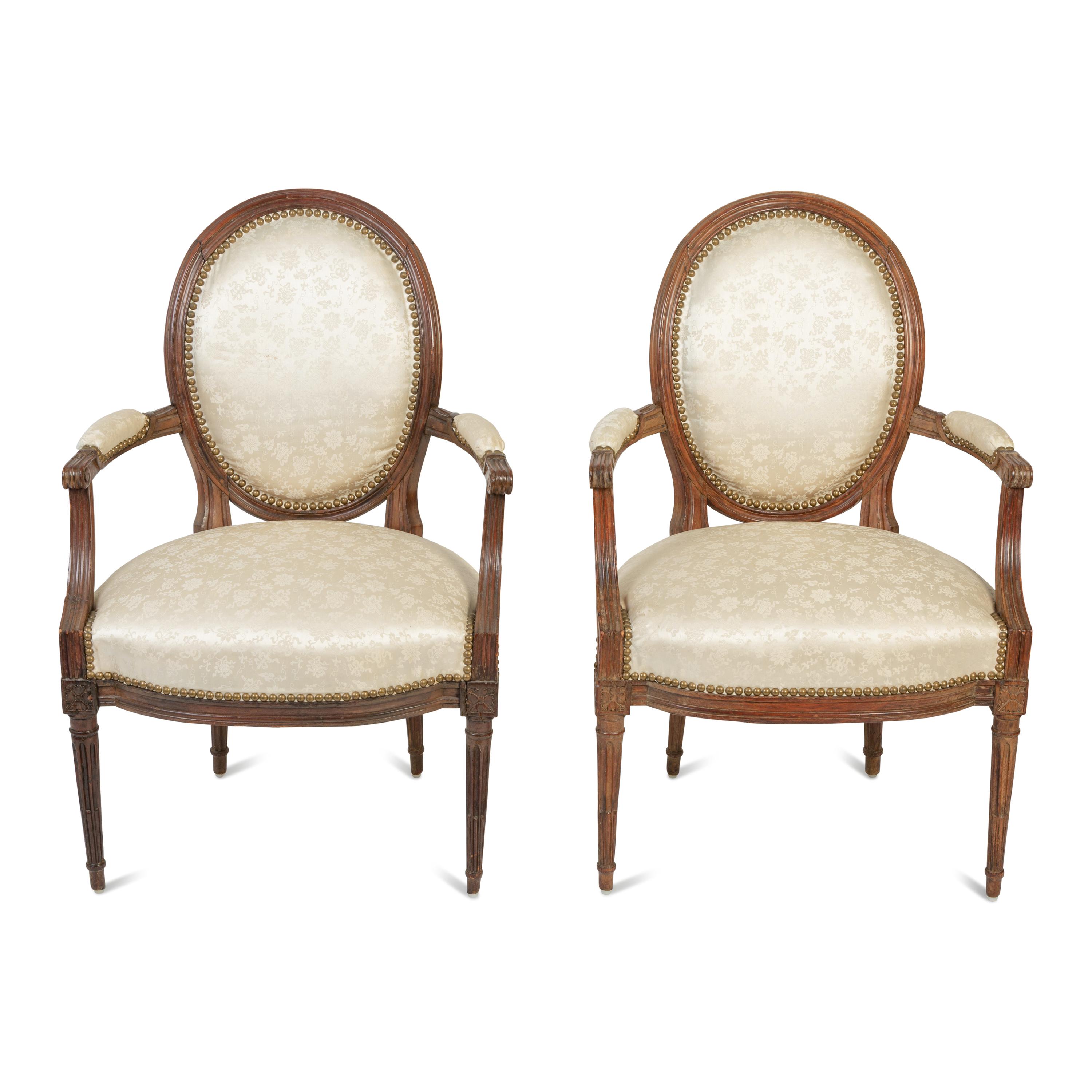 A Pair of Louis XVI Walnut Fauteuils en Cabriolet